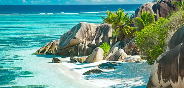 Beautiful view of beach and mountains from luxury vacation in Seychelles East Africa