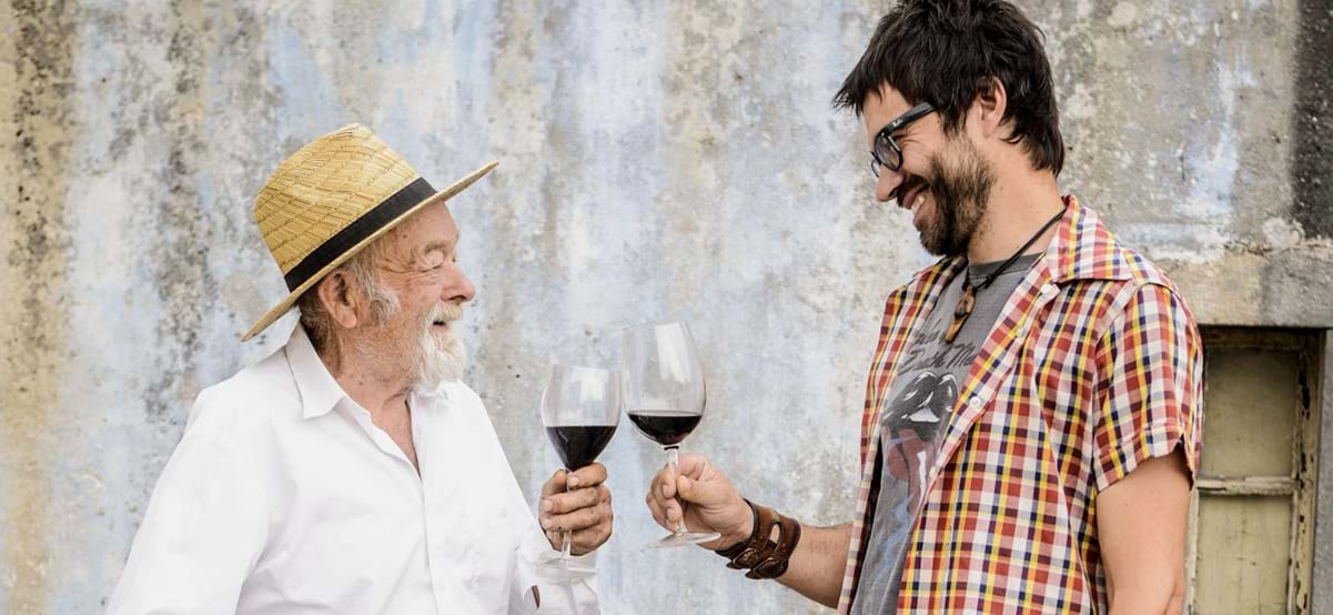 Man and tour guide toasting with a glass of wine during luxury international culinary vacation in Croatia 