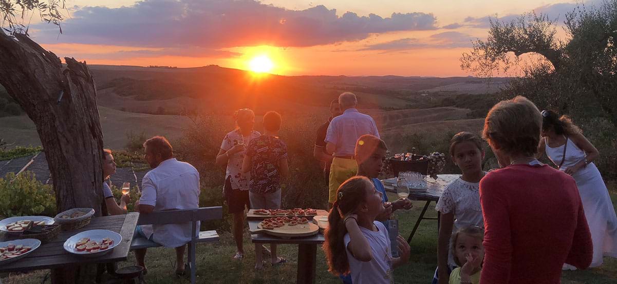 Sunset diner with tapas, wine, family and friends, Tuscany, Italy