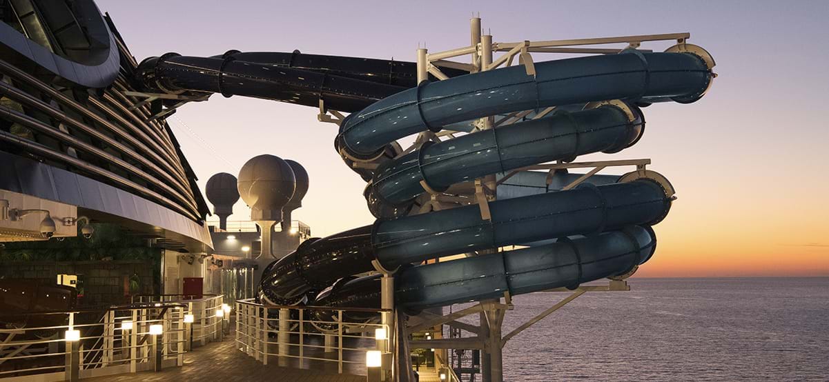 Waterslide at sunset on MSC Seaside Cruise during luxury family vacation