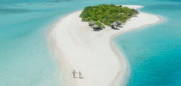 Alifu Alifu Atoll Maldives honeymoon couple on beach